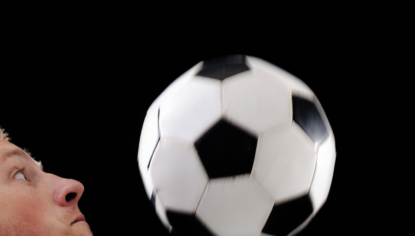 generic men's soccer-- Young football player with ball